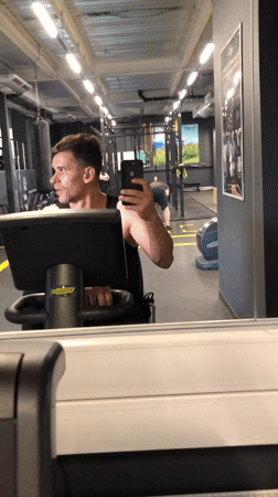 Man takes gym selfie on exercise bike in Saint Petersburg