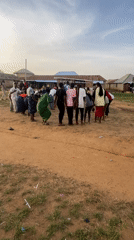 Group gathering in rural Nigeria features coordinated activity