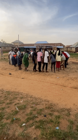 Group gathering in rural Nigeria features coordinated activity