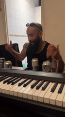 Street musician raps at keyboard in Barcelona