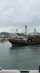 On the water in Batumi's harbor, city landmarks in view
