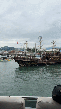 On the water in Batumi's harbor, city landmarks in view