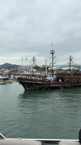 On the water in Batumi's harbor, city landmarks in view