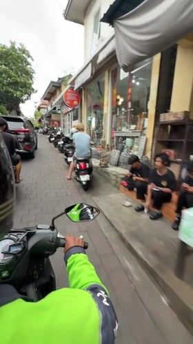 Morning scooter tour through Ubud's pottery markets documented
