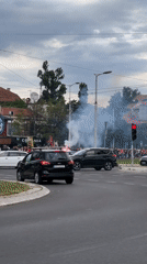 Crowd with flares gathers near Belgrade roundabout