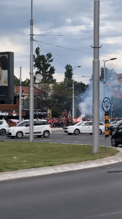Crowd with flares gathers near Belgrade roundabout