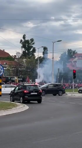 Crowd with flares gathers near Belgrade roundabout