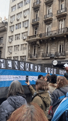 Street protest in Buenos Aires with banners and police presence
