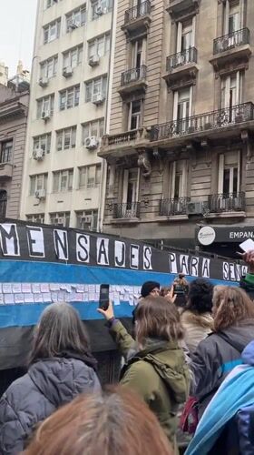 Street protest in Buenos Aires with banners and police presence