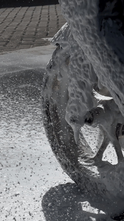Vehicles washed at car wash facility in Denpasar