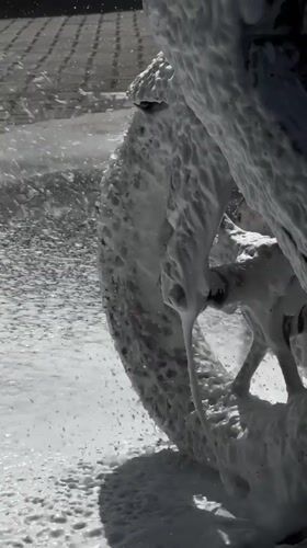 Vehicles washed at car wash facility in Denpasar