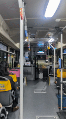 Bus passengers travel through Busan on afternoon route
