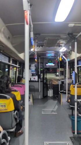 Bus passengers travel through Busan on afternoon route