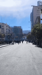 Large crowds gather, move through central La Paz streets