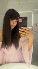 Woman takes mirror selfie in Khimki, Russia