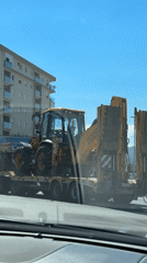 Construction equipment transport with police escort in Podgorica