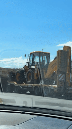 Construction equipment transport with police escort in Podgorica