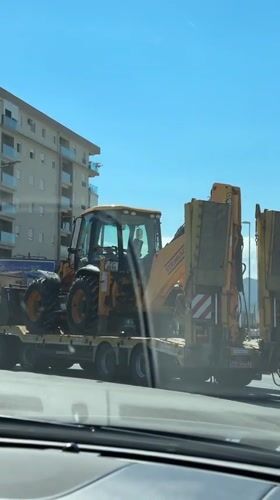 Construction equipment transport with police escort in Podgorica