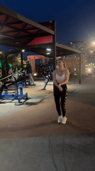 Woman jump ropes at outdoor gym in Batumi evening