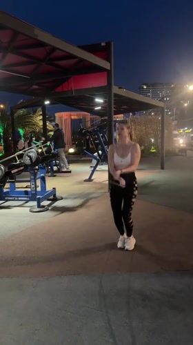 Woman jump ropes at outdoor gym in Batumi evening