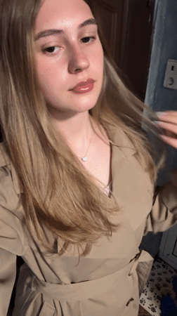 Woman takes mirror selfies indoors in Panagyurishte, Bulgaria