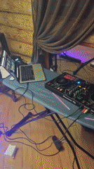 DJ setup documented in small Belarus venue with party lighting