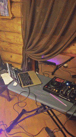 DJ setup documented in small Belarus venue with party lighting