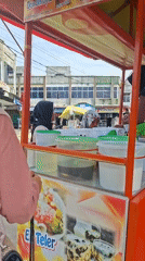 Busy street dessert cart serving customers in Keudegeudong, Indonesia
