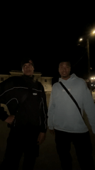 Two young men spotted standing outside at night in Lozarevo