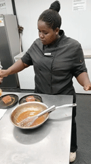 Chef prepares charcuterie board in Botswana commercial kitchen