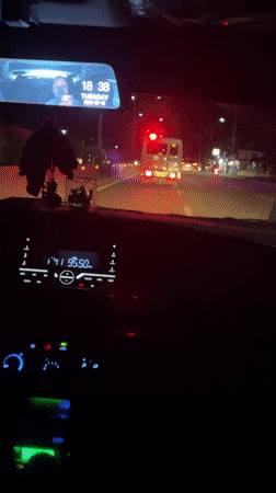 Ambulance with flashing lights travels Hagonoy road at night