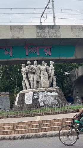 Morning scenes captured in Dhaka: statue monument and rickshaw travel