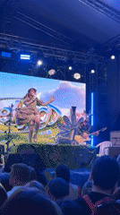 Costumed dancer performs with tambourine at Moscow stage show