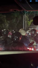 Heavy nighttime traffic with motorcyclists documented in Central Jakarta