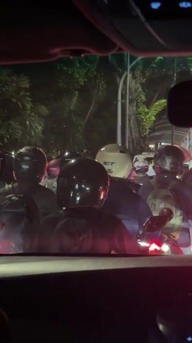 Heavy nighttime traffic with motorcyclists documented in Central Jakarta