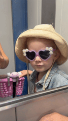 Morning moments: child in heart sunglasses, woman takes elevator selfie