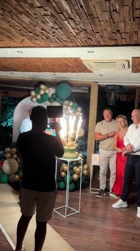 70th birthday party in Sredets with cake, sparklers, and dancing