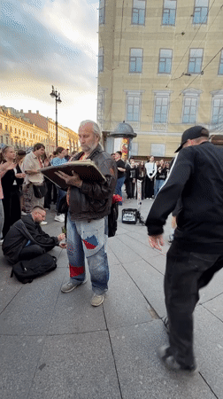 Live street performance draws a crowd in central Saint Petersburg