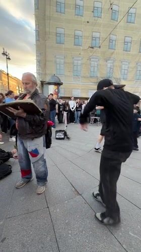 Live street performance draws a crowd in central Saint Petersburg