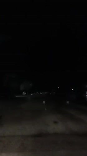 Purple light flash captured on dark road in Bulgaria