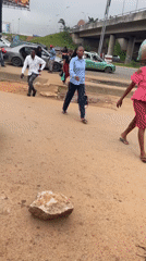 Morning street traffic and pedestrians moving through Abuja