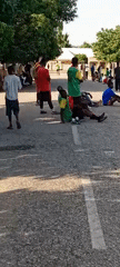 Afternoon gathering and sandal displays from an outdoor market setting