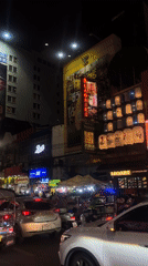 Bangkok's Chinatown at night, streets and snacks included