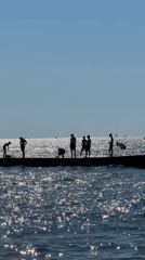 Sunny afternoon on a Sochi pier, Black Sea in full swing