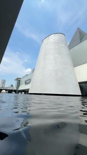 Early morning pedestrian activity near Bangkok's modern architectural landmarks