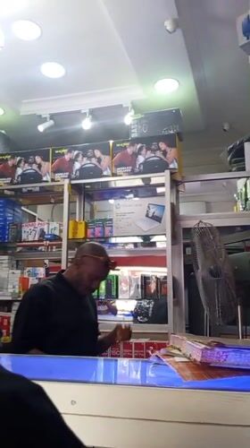 Inside and outside an Abuja electronics retail district