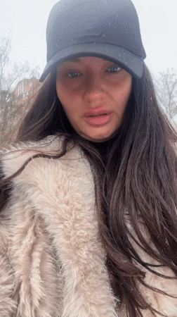 Woman records selfie videos during snowfall in Krasnogorsk