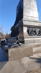 Bronze monument observed in Sevastopol featuring coated figure