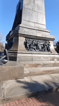 Bronze monument observed in Sevastopol featuring coated figure