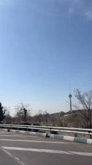 Morning drive captured on Tehran road near parkland